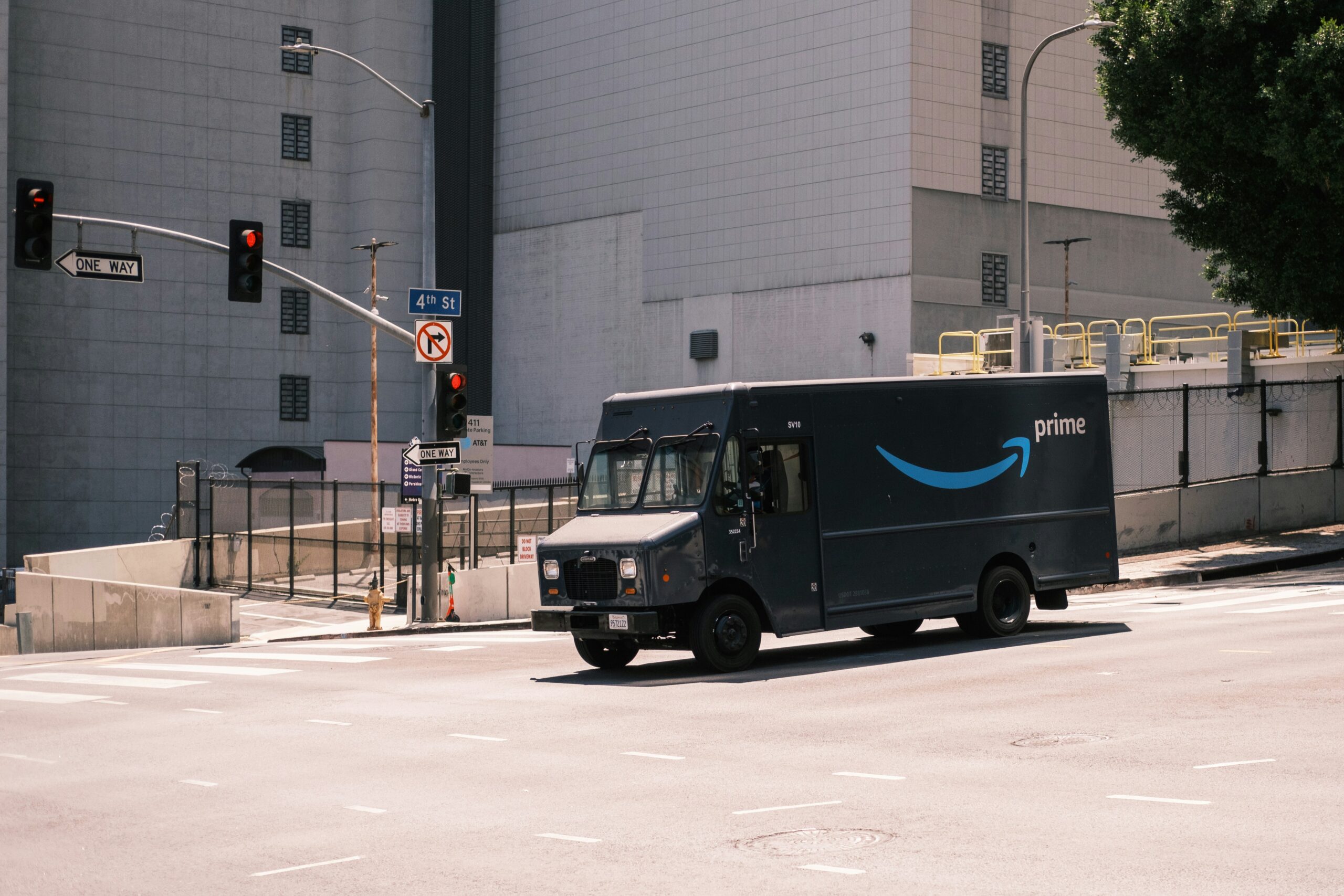 Amazon delivery vehicle navigating the streets of Los Angeles, showcasing Amazon’s far-reaching influence on e-commerce and the passive income dreams of sellers.